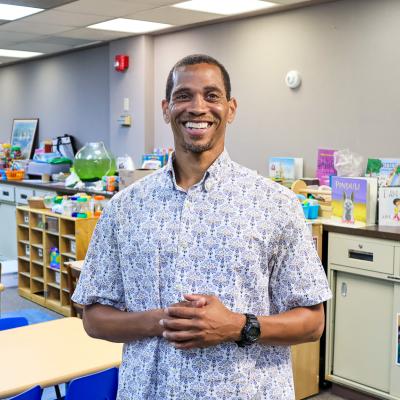 Muhammad standing in a Head Start classroom