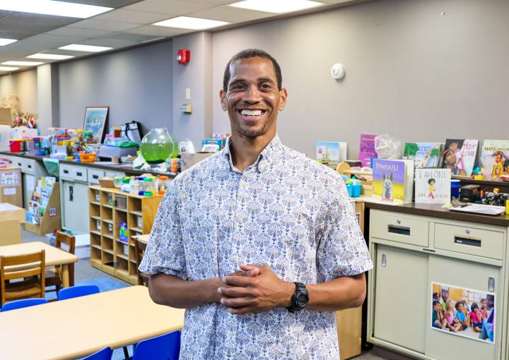 Muhammad standing in a Head Start classroom
