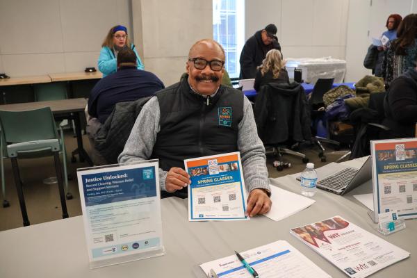 man at job fair booth